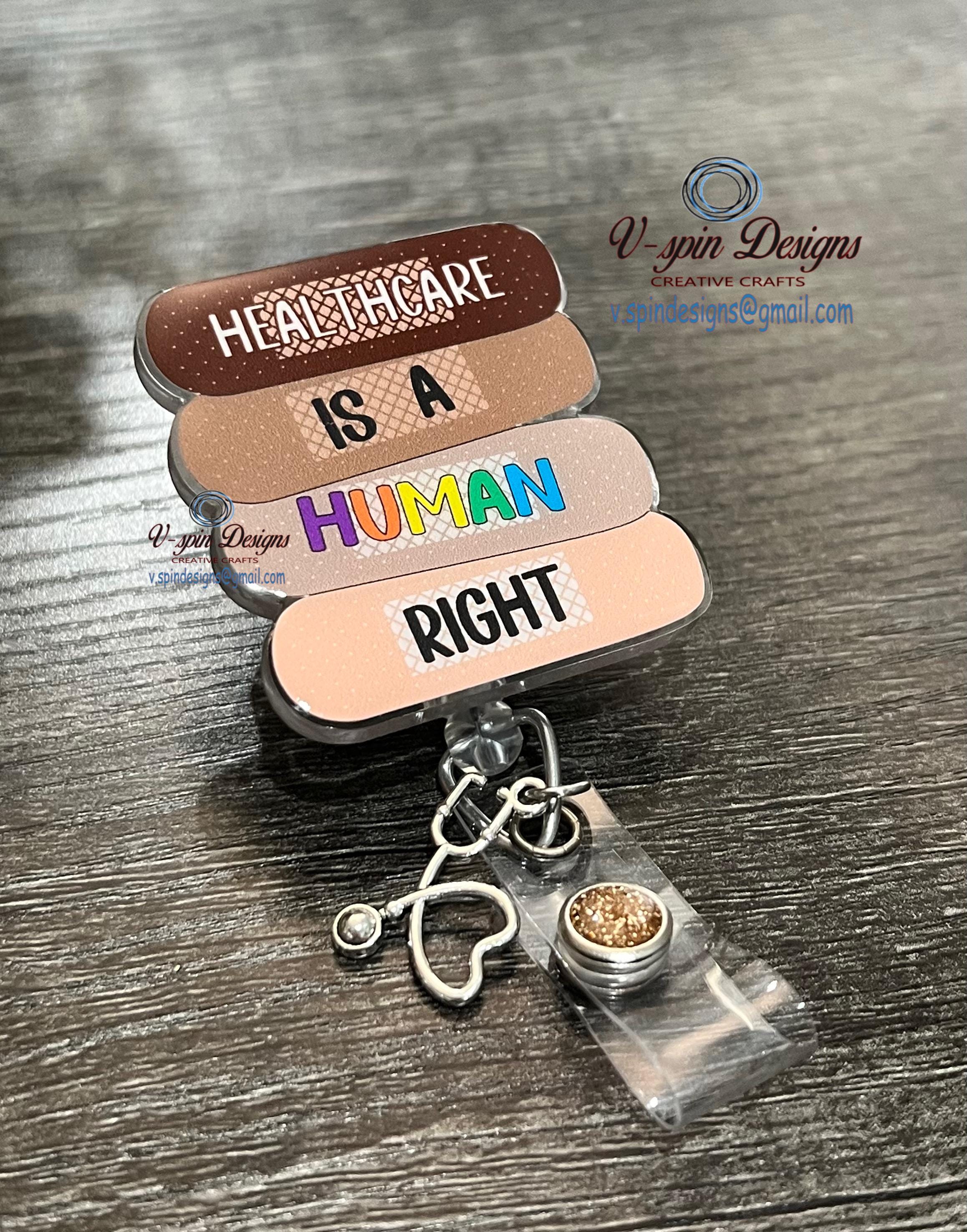 "Healthcare Is A Human Right" Badge Reel | Band-Aid Acrylic Retractable ID Holder