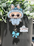 Cute light blue little Standing Monster with bow/nurse badge reels