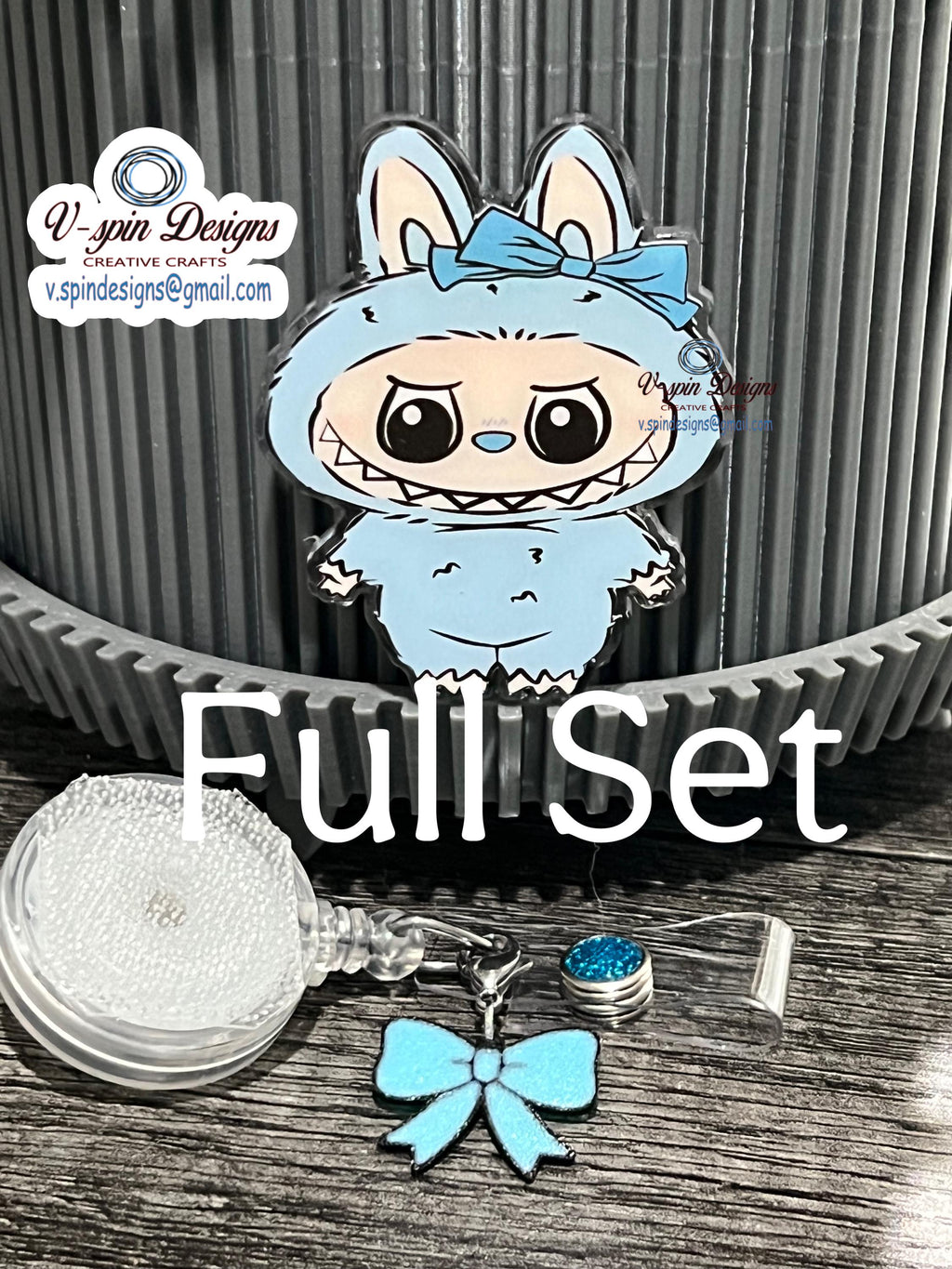 Cute light blue little Standing Monster with bow/nurse badge reels