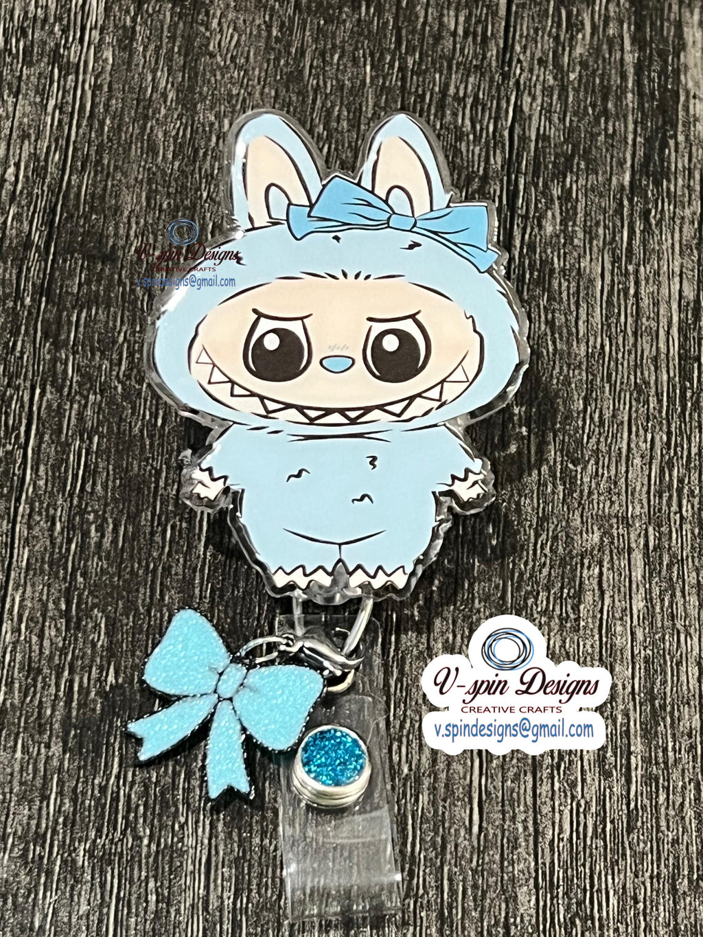 Cute light blue little Standing Monster with bow/nurse badge reels